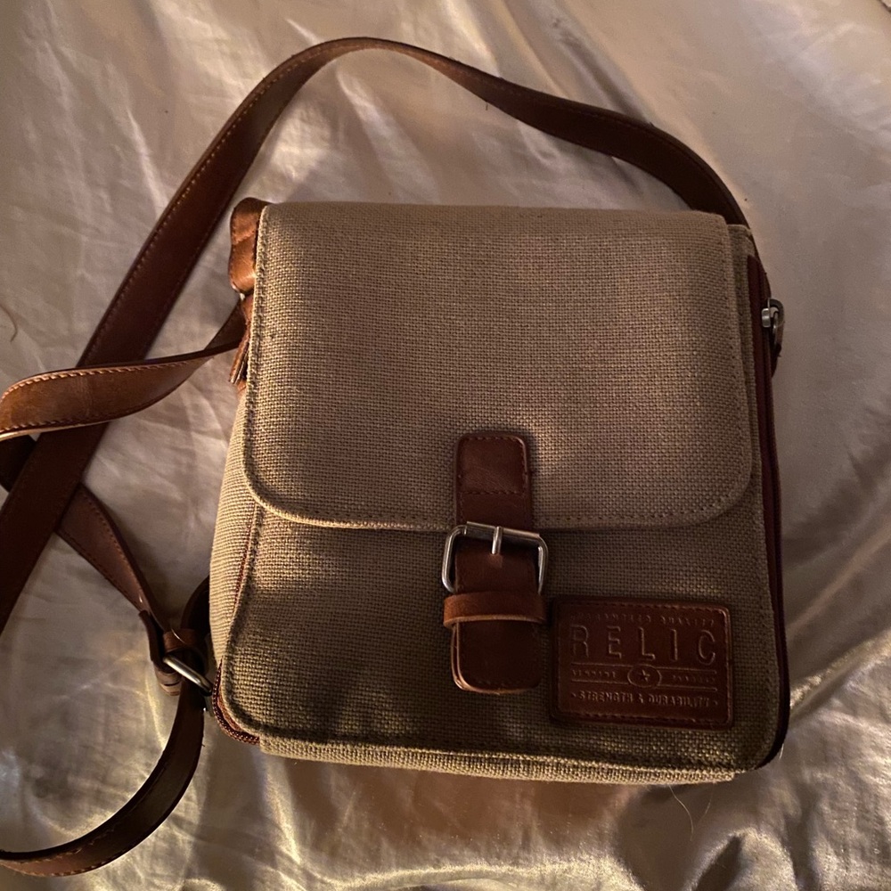 green and brown leather purse with lots of storage
